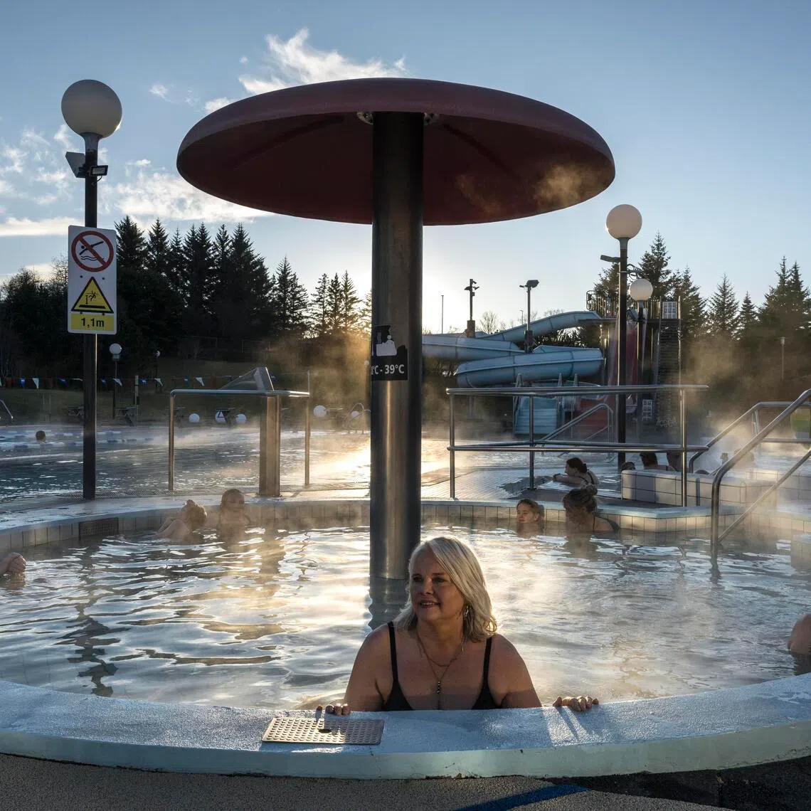 Ms Thordis Erla Agustsdottir, a photographer who documents Iceland's pool culture, at an outdoor public pool in Reykjavik, Iceland, on Feb 13. 