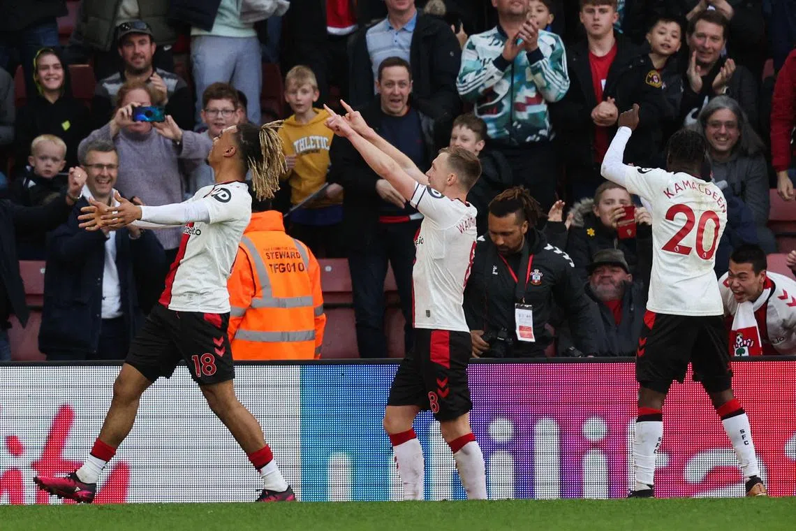 Southampton's James Ward-Prowse celebrates with teammates after scoring the equaliser from the penalty spot.