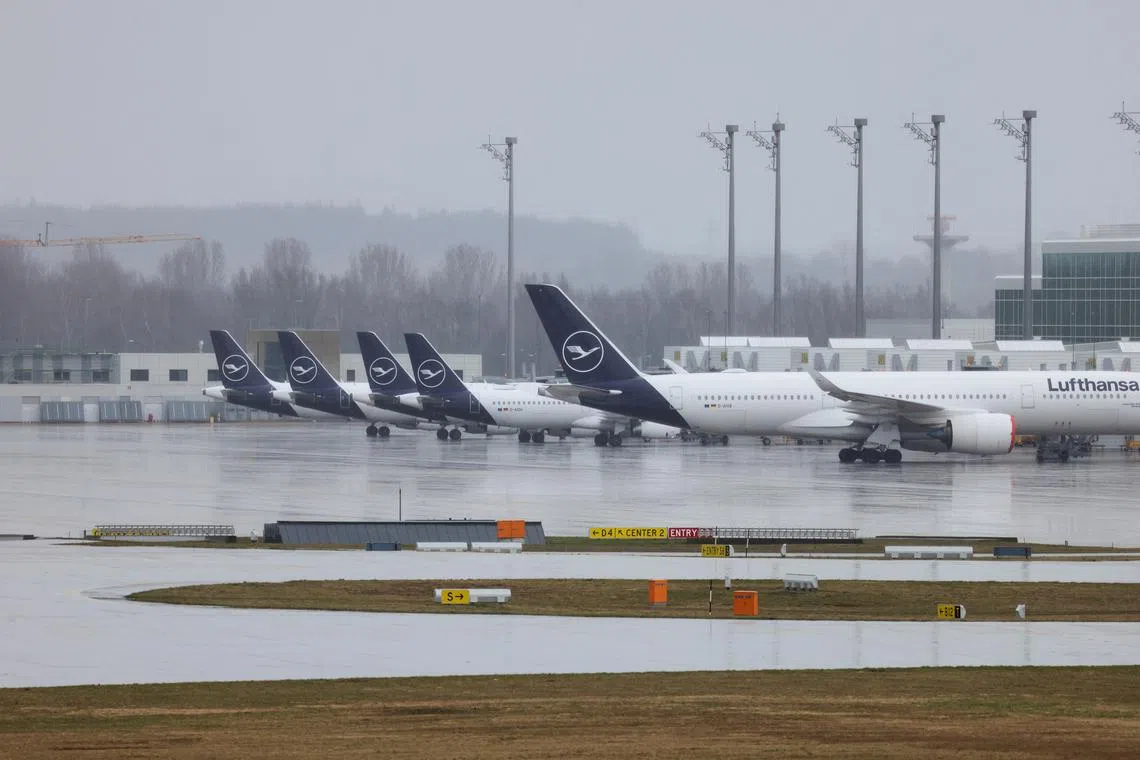 FILE PHOTO: Planes are parked at the Munich Airport during a strike called by the German trade union Verdi over a wage dispute, in Munich, Germany, March 26, 2023. REUTERS/Lukas Barth/File Photo