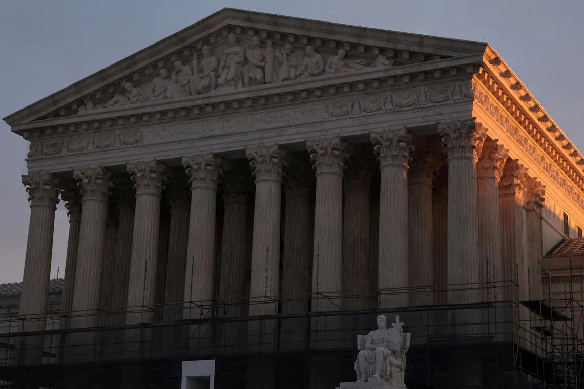 FILE PHOTO: Light from the rising sun hits the U.S. Supreme Court building at the start of the day in Washington, D.C. U.S., January 12, 2026. REUTERS/Jonathan Ernst/File Photo