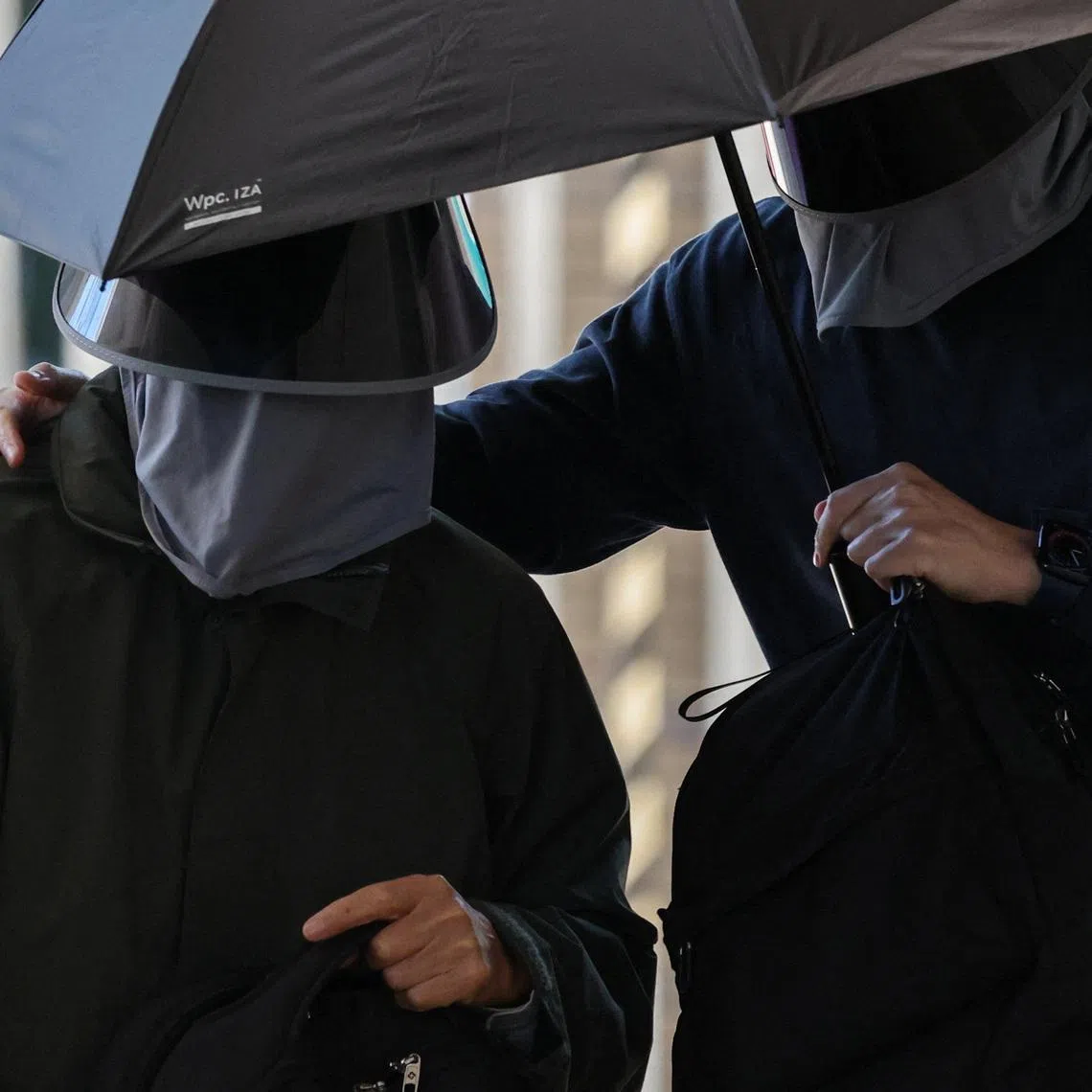 Kwok Yin-sang, father of wanted U.S.-based activist Anna Kwok, arrives at the West Kowloon Magistrates’ Courts building in Hong Kong, China, February 11, 2026. REUTERS/Tyrone Siu