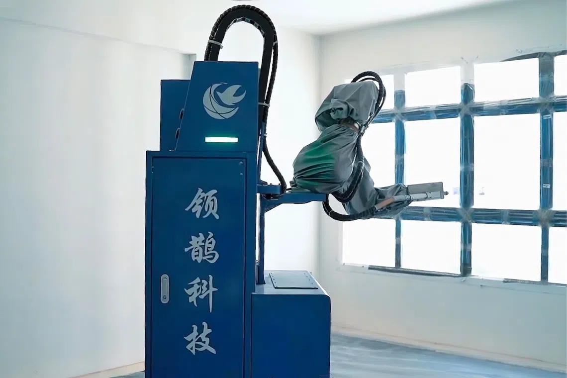 Painting robots helped reduce man-hours at MacPherson Weave, with one worker able to operate two robots at a time.