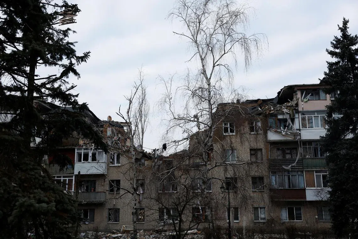 Apartment buildings damaged from missile strikes are seen during intense shelling at the frontline in Bakhmut, Ukraine, on Dec 25, 2022.