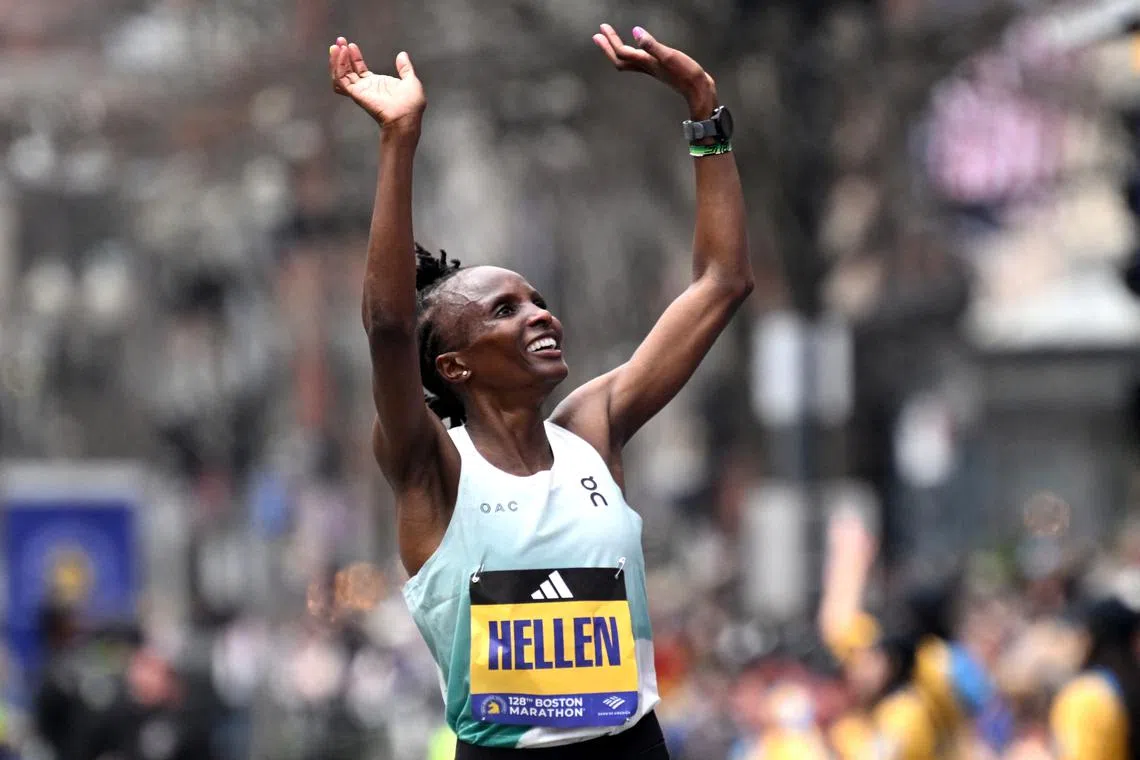 FILE PHOTO: Athletics - The 128th Boston Marathon - Boston, Massachusetts, U.S. - April 15, 2024  Kenya's Hellen Obiri celebrates after winning the women's elite race REUTERS/Ken Mcgagh/File Photo