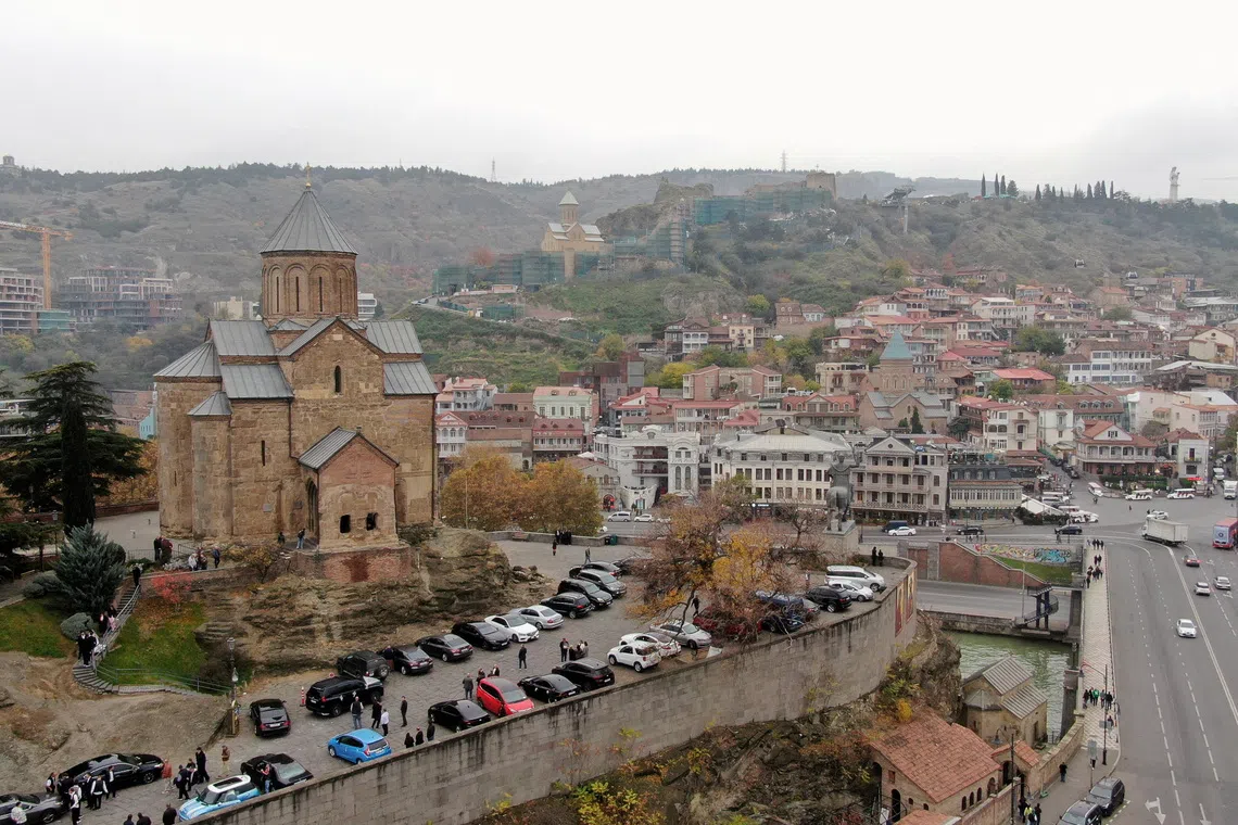 FILE PHOTO: A drone view of the city of Tbilisi, Georgia, November 15, 2025. REUTERS/Irakli Gedenidze/File Photo