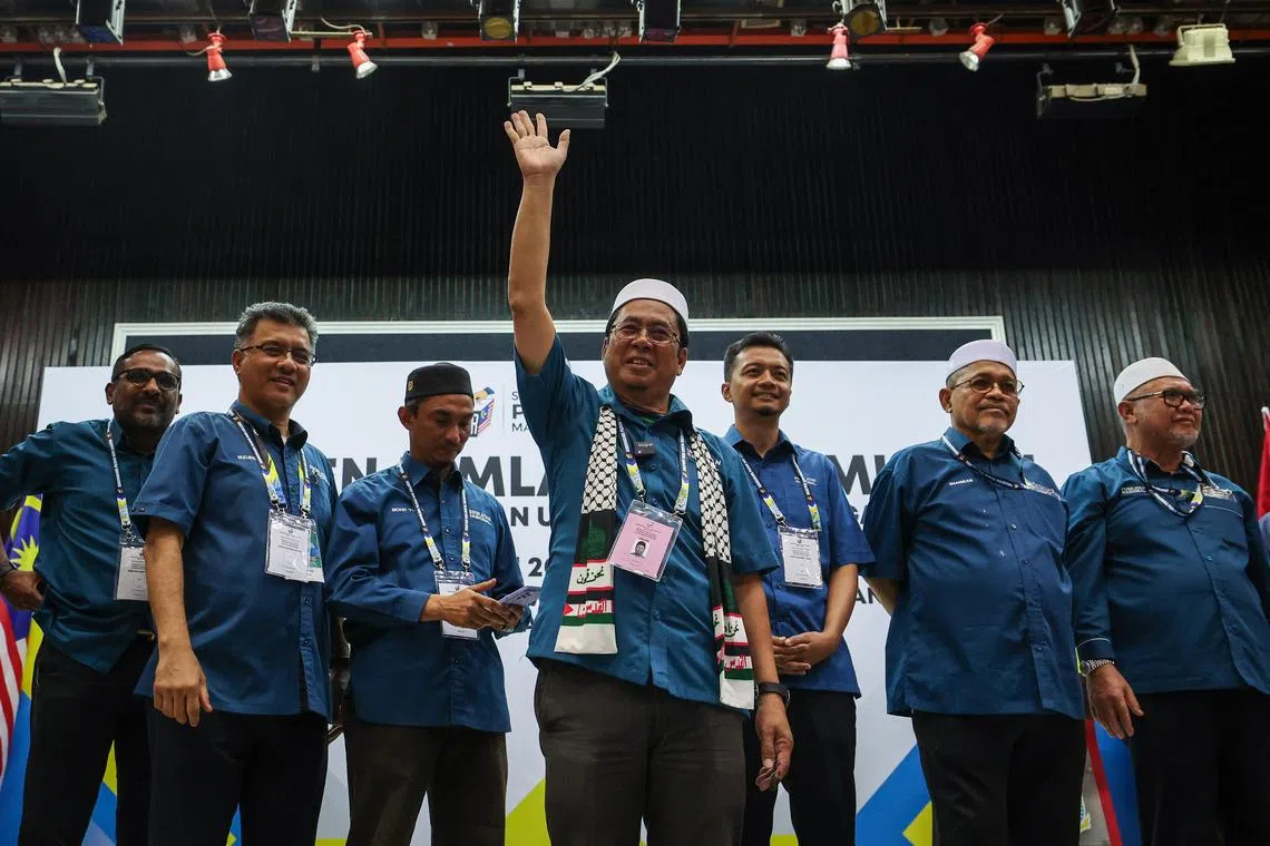 Mr Abidin Ismail (centre) from Parti Islam SeMalaysia, a member of the PN alliance, won the Sungai Bakap seat with about 58.6 per cent of the valid votes.