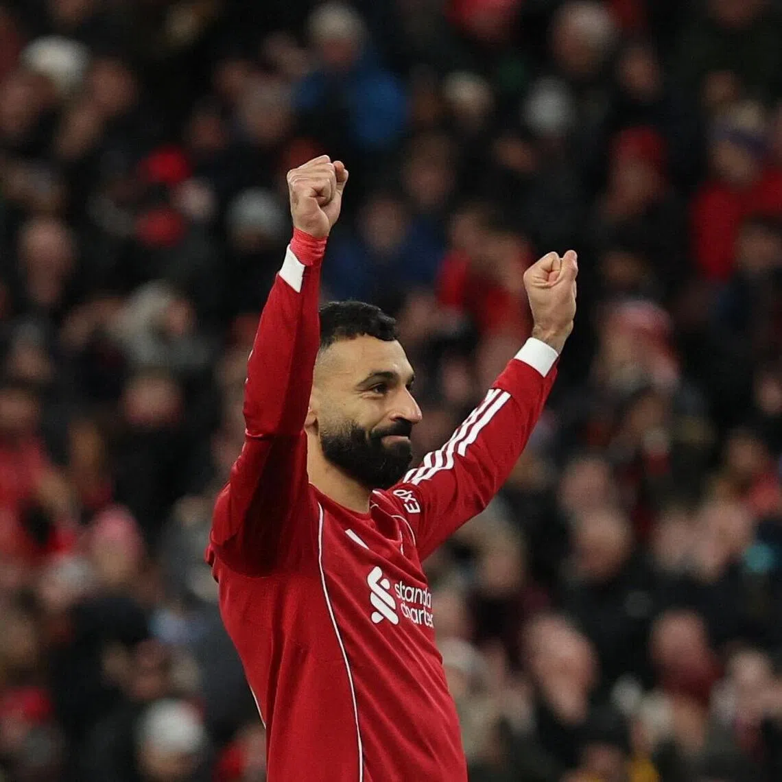 Liverpool's Mohamed Salah celebrates scoring their third goal from the penalty sport against Brighton on Feb 14.