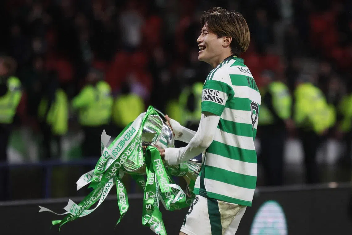 Soccer Football - Scottish League Cup - Final - Celtic v Rangers - Hampden Park, Glasgow, Scotland, Britain - December 15, 2024 Celtic's Kyogo Furuhashi celebrates with the trophy after winning the League Cup REUTERS/Russell Cheyne/ File Photo