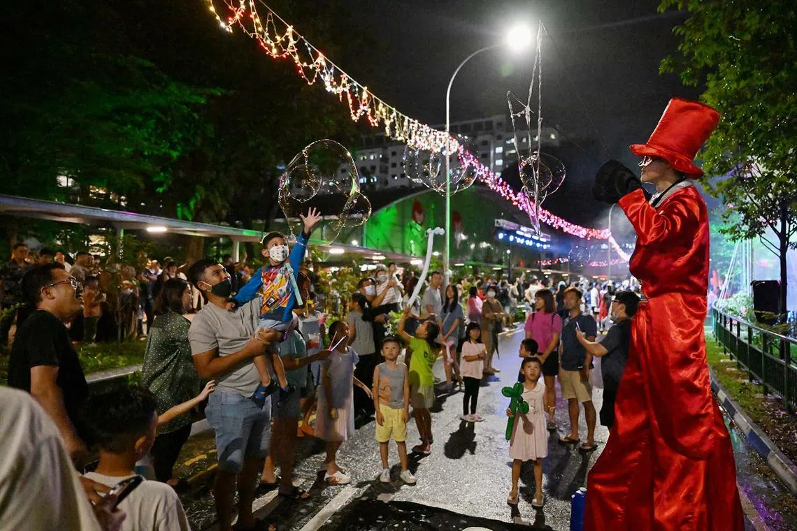 Revellers at Sembawang GRC's first-ever Countdown Street Party held along Woodlands Ring Road to welcome the new year on Dec 31, 2023.