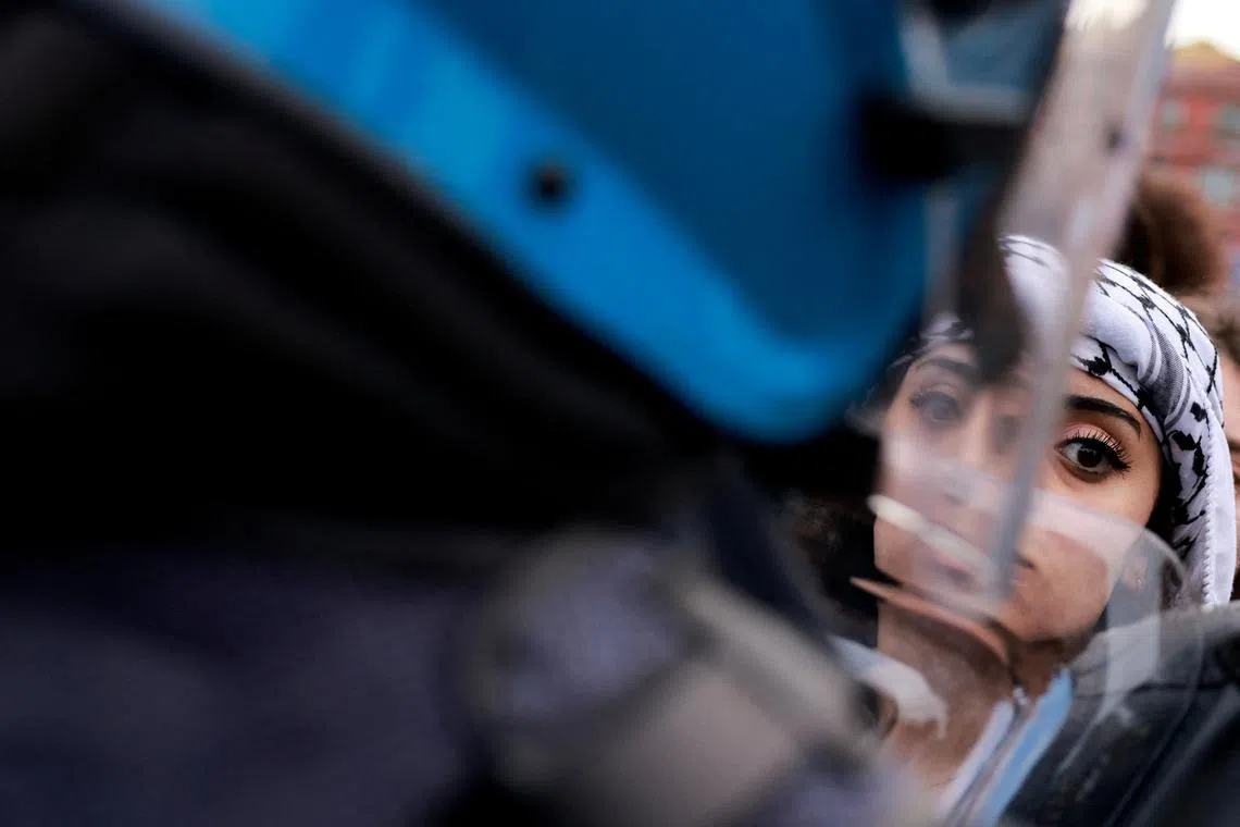 A pro-Palestinian activist looking on as she participates in a demonstration at the 79th anniversary of the Liberation Day in Rome, Italy, on April 25, 2024. 