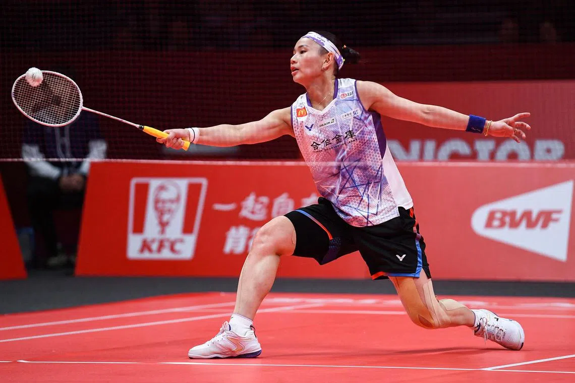 Chinese Taipei's Tai Tzu-ying hits a return during her semi-final clash against South Korea's An Se-young at the BWF World Tour Finals.