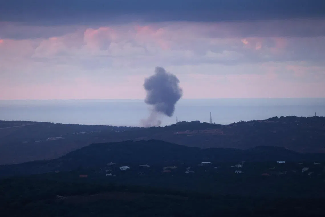 Smoke billowing after an Israeli strike on the southern Lebanese area of Naqura on Nov 16, 2023.