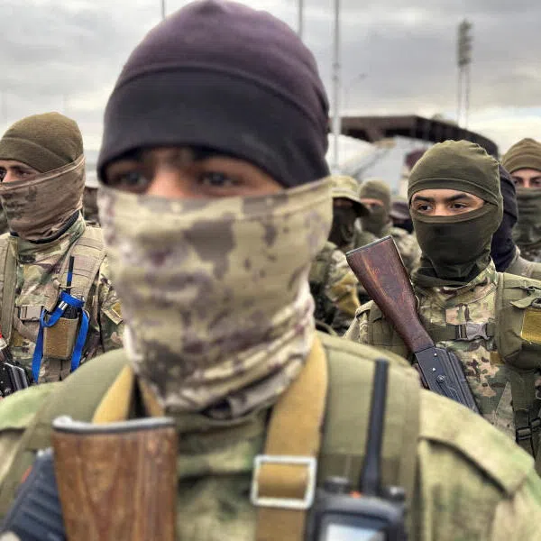 Khaled Brigade, a part of Hay'at Tahrir al-Sham, hold a military parade in Damascus, Syria, on Dec 27, 2024.