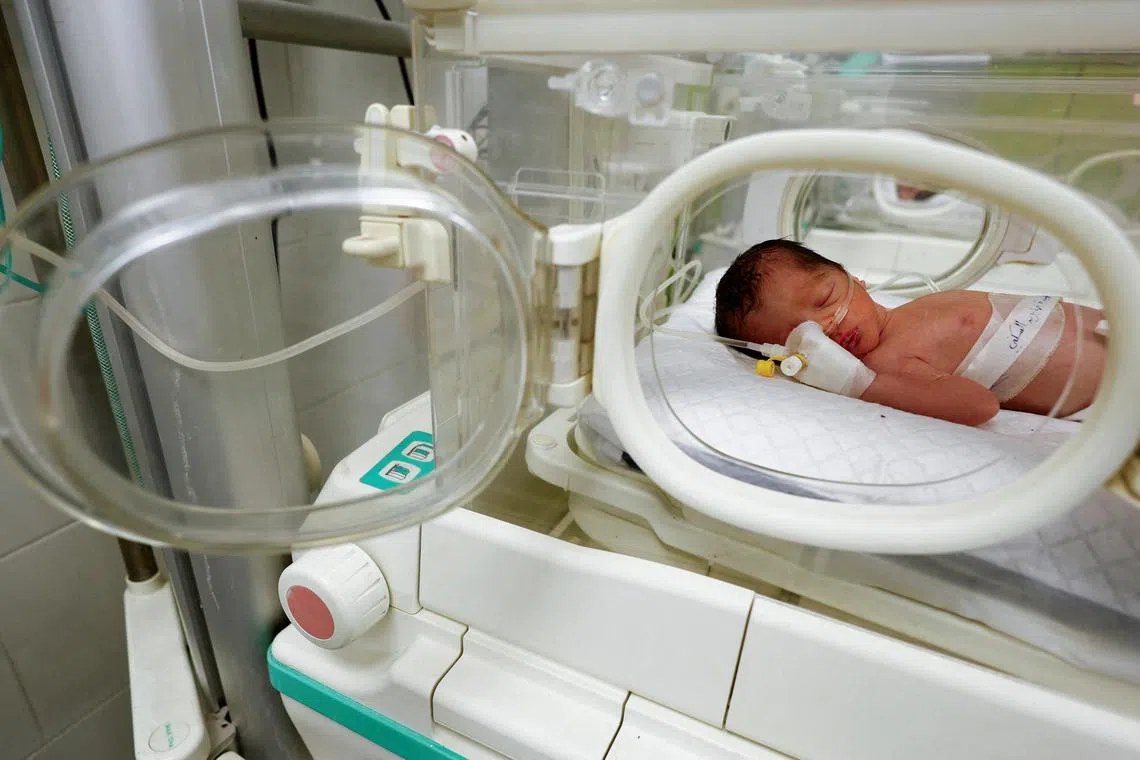 A Palestinian baby girl, saved from the womb of her mother Sabreen Al-Sheikh (Al-Sakani), who was killed in an Israeli strike along with her husband Shokri and her daughter Malak, lies in an incubator at Al-Emirati hospital in Rafah in the southern Gaza Strip April 21, 2024. REUTERS/Mohammed Salem