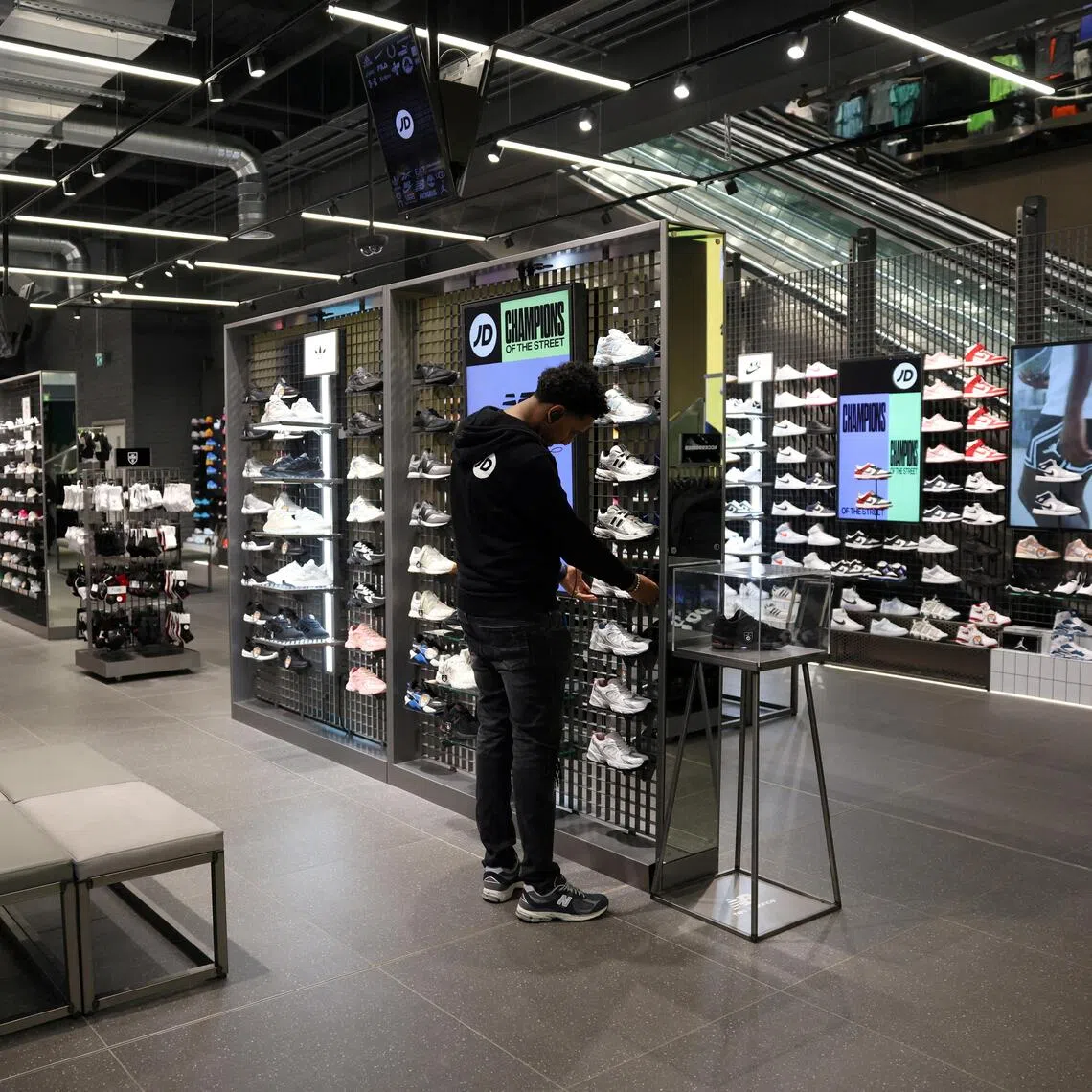 JD Sports cut its profit outlook as its customers grapple with cost-of-living pressures.