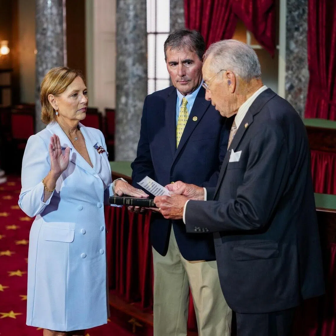 (From left) Senator Darline Graham Nordone, a Republican from South Carolina, her husband Larry Nordone, and Senator Chuck Grassley, a Republican from Iowa, during her swearing-in ceremony on July 14.
