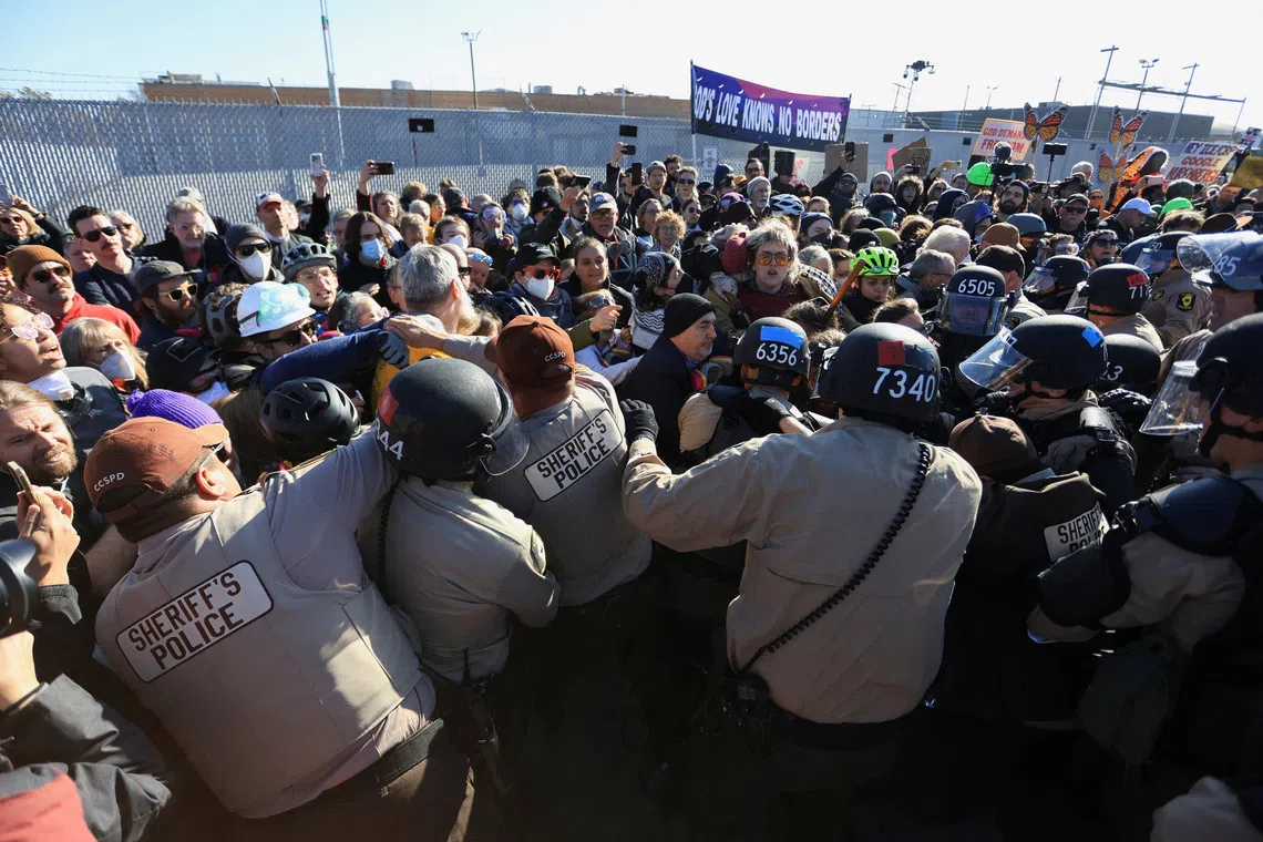 Faith leaders clash with Illinois State Police during a protest against immigration actions, in Chicago, Illinois, on Nov 14.