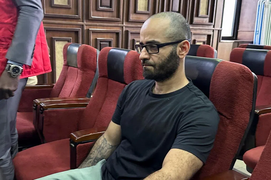 FILE PHOTO: Tigran Gambaryan, an executive of Binance, the world's largest cryptocurrency exchange, sits as he waits to face prosecution for tax evasion and money laundering at the federal high court in Abuja, Nigeria April 4, 2024. REUTERS/ Abraham Achirga/File Photo