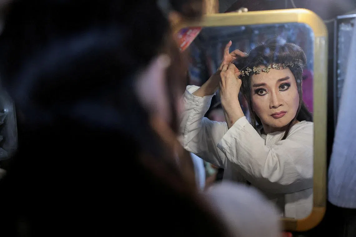 Performers of a Taiwanese Opera team preparing backstage before a show in New Taipei City, Taiwan Sep 9, 2024. 