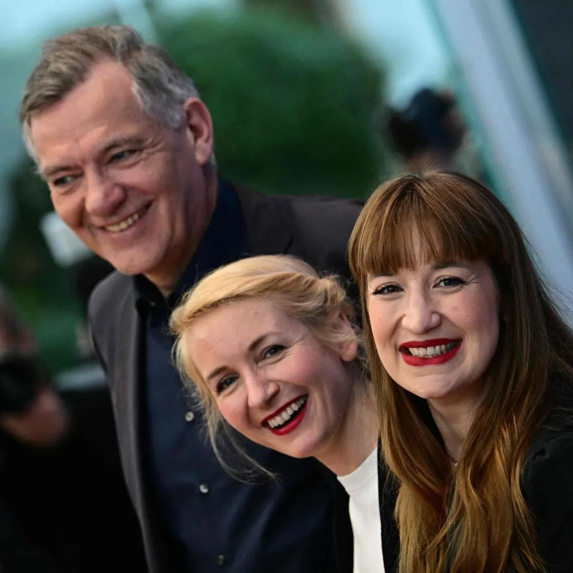 Members of the left-wing Die Linke (The Left) party Jan van Aken (L) and Ines Schwerdtner (C) , with Heidi Reichinnek (R).