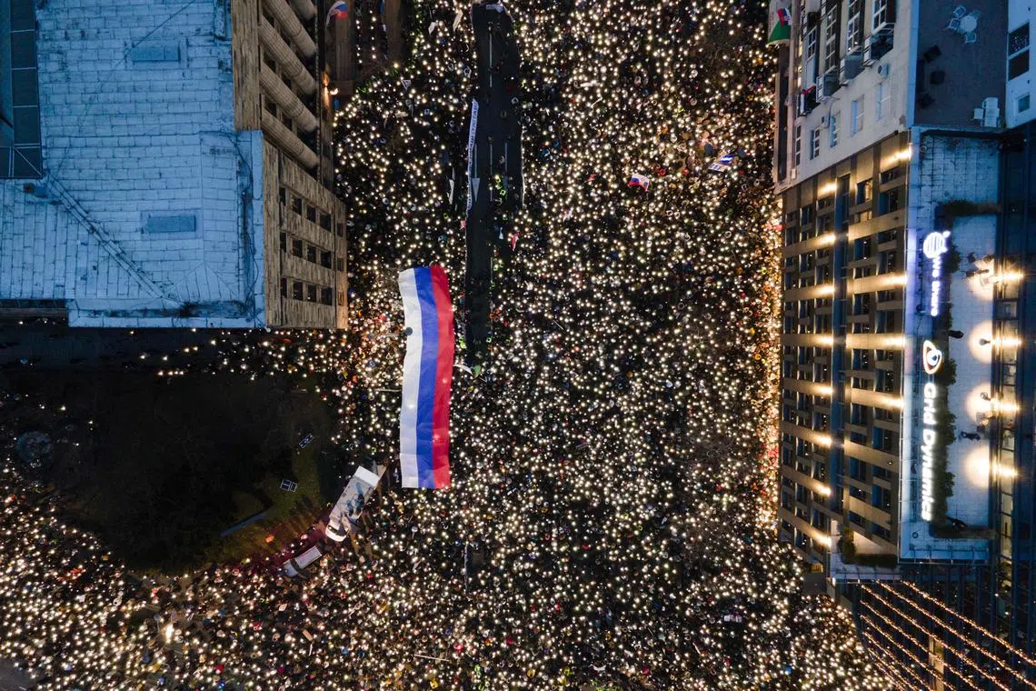 TOPSHOT - This aerial photograph shows demonstrators and students as they gather in front of Serbia's Constitutional Court building during a protest to demand accountability for the Novi Sad railway station tragedy, in Belgrade, on January 12, 2025. Thousands of Serbians protested in the capital Belgrade on January 12, 2025, against corruption and demanding justice for those killed in a train station roof collapse. The demonstrations have been ongoing for two months since a roof in a train station in the northern city of Novi Sad, which had recently undergone restoration work, collapsed on November 1, 2024, and killed 15 people. (Photo by TADIJA ANASTASIJEVIC / AFP)