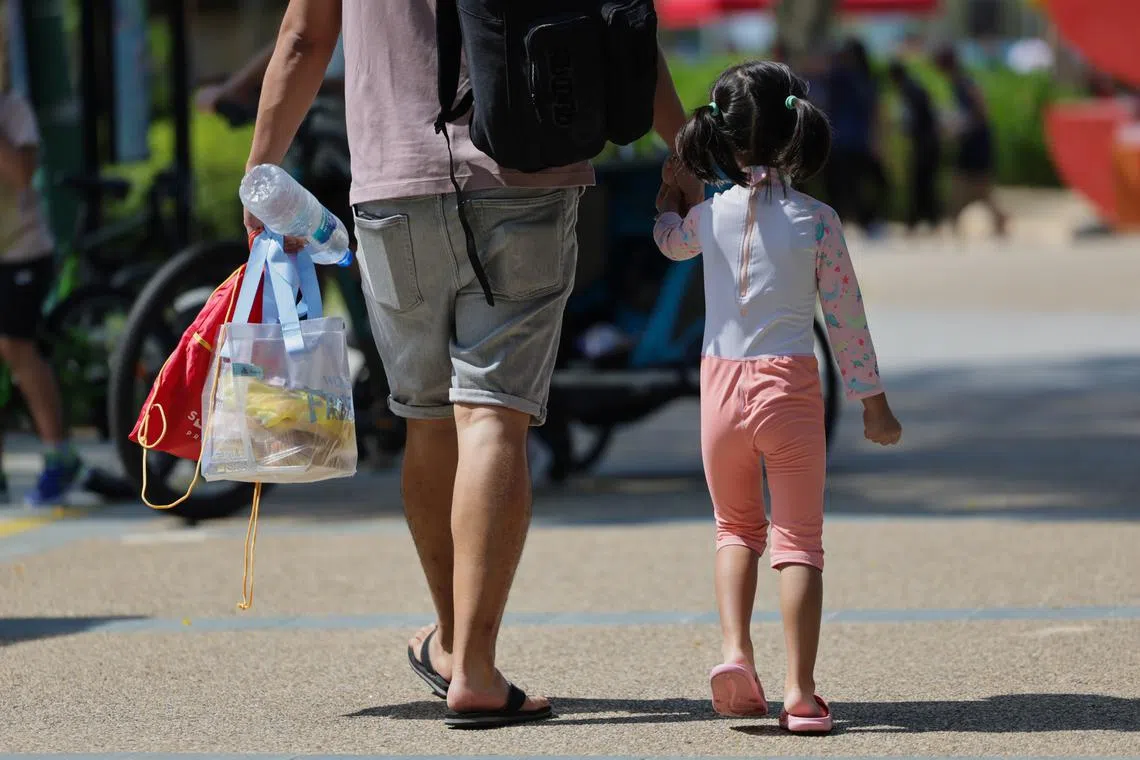 Generic photo of a man holding hand with a child/toddler, at Palawan beach, on May 1, 2024. Can use for stories on parenthood,  father,  parenting, family, relationship, birth rate, childhood, adoption, fostering, special needs, emotional well being, child custody for dad, 