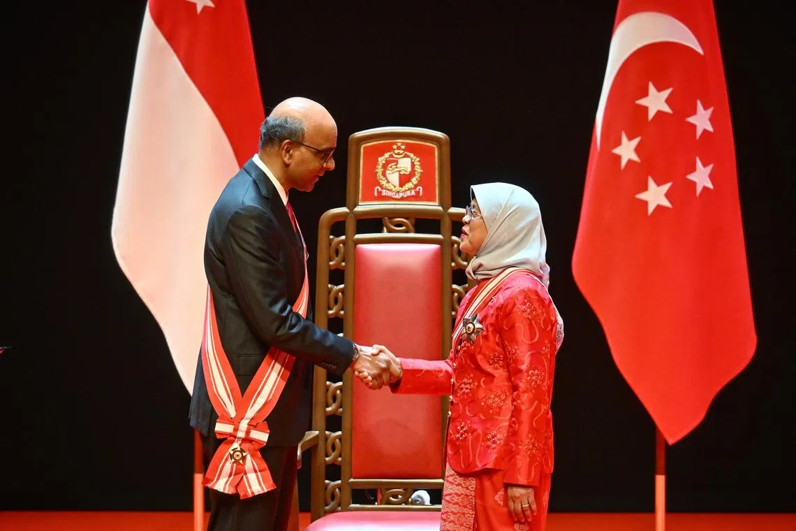 Former president Halimah Yacob receiving the Order of Temasek (With High Distinction) from President Tharman Shanmugaratnam on Oct 29.