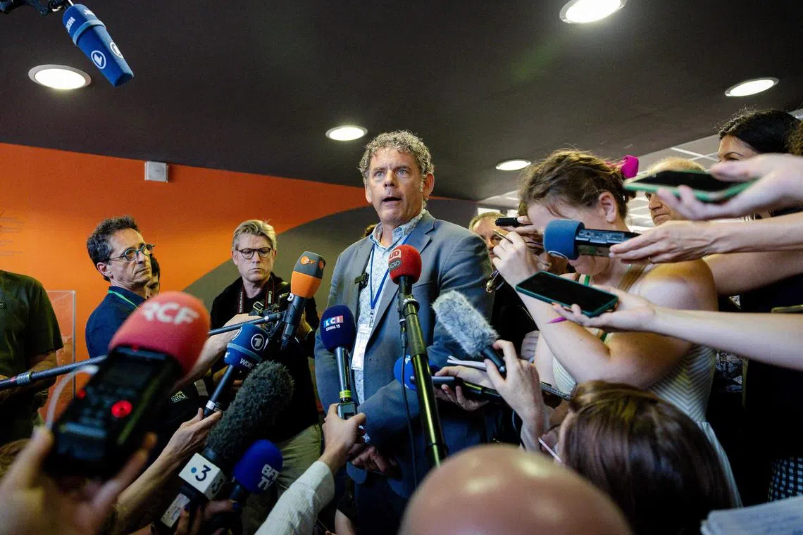 US historian Brian Sandberg (centre) - a beneficiary of the "Safe Place for Science" programme - taking part in a press conference in Marseille, southeastern France, on June 26.