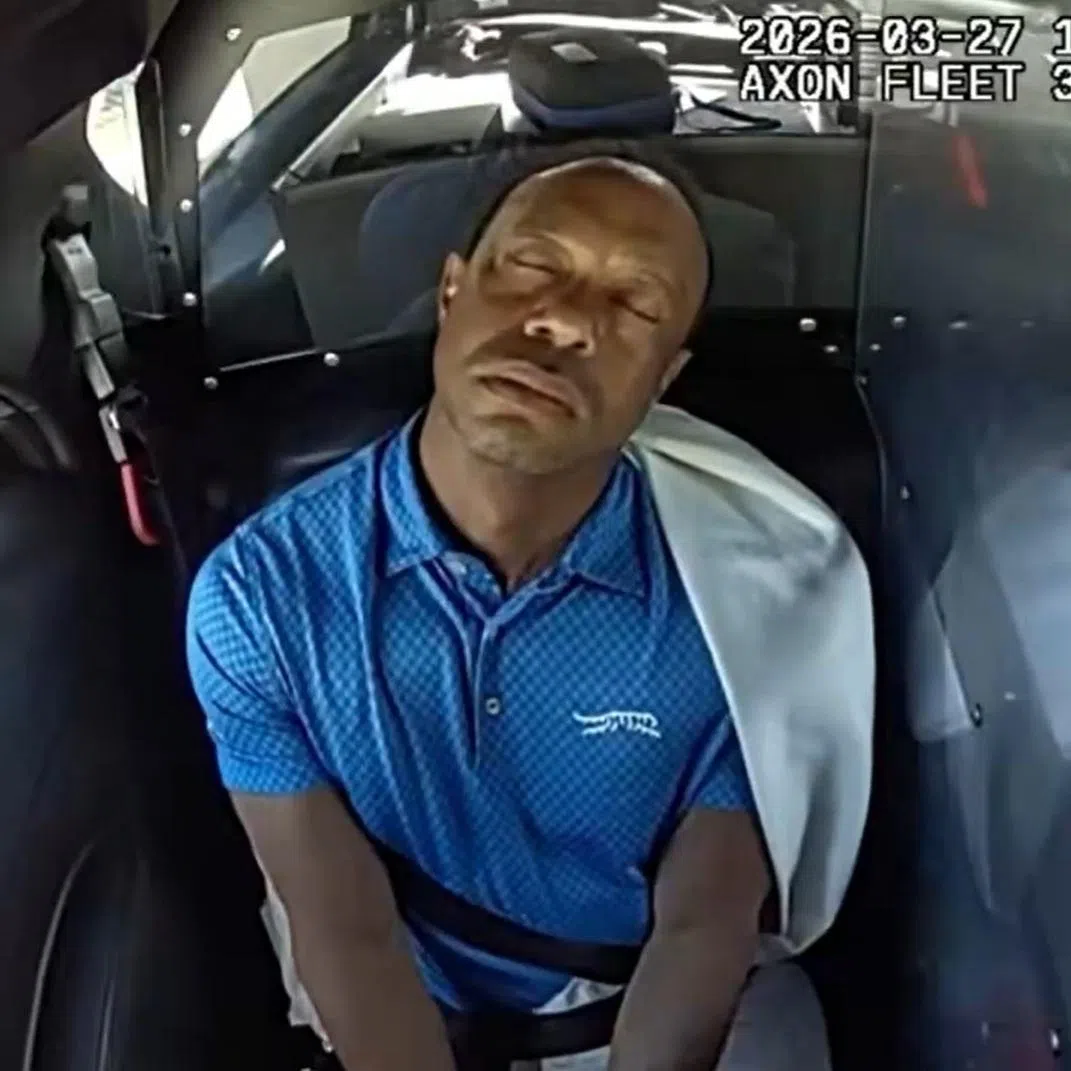 A video screengrab showing Tiger Woods in the back of a police car after crashing his SUV and undergoing a sobriety test.