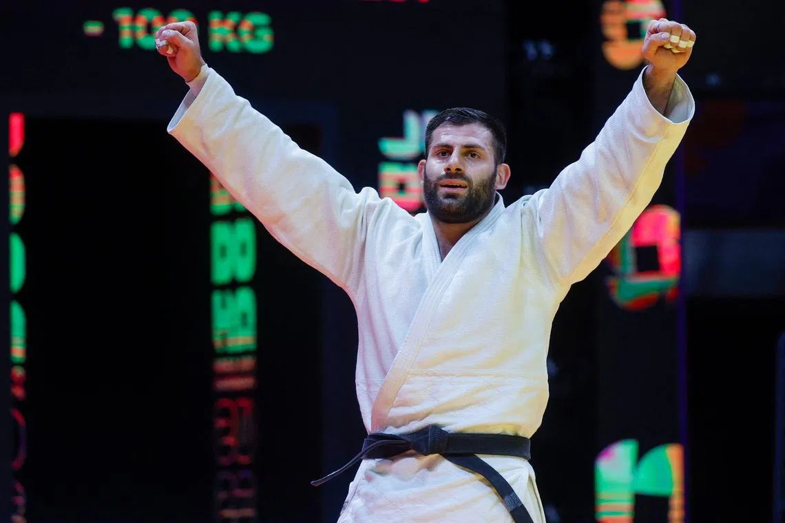 Russia's Arman Adamian celebrates after defeating Czech Republic's Lukas Krpalek in their -100Kg final bout at the World Judo Championship in Doha.