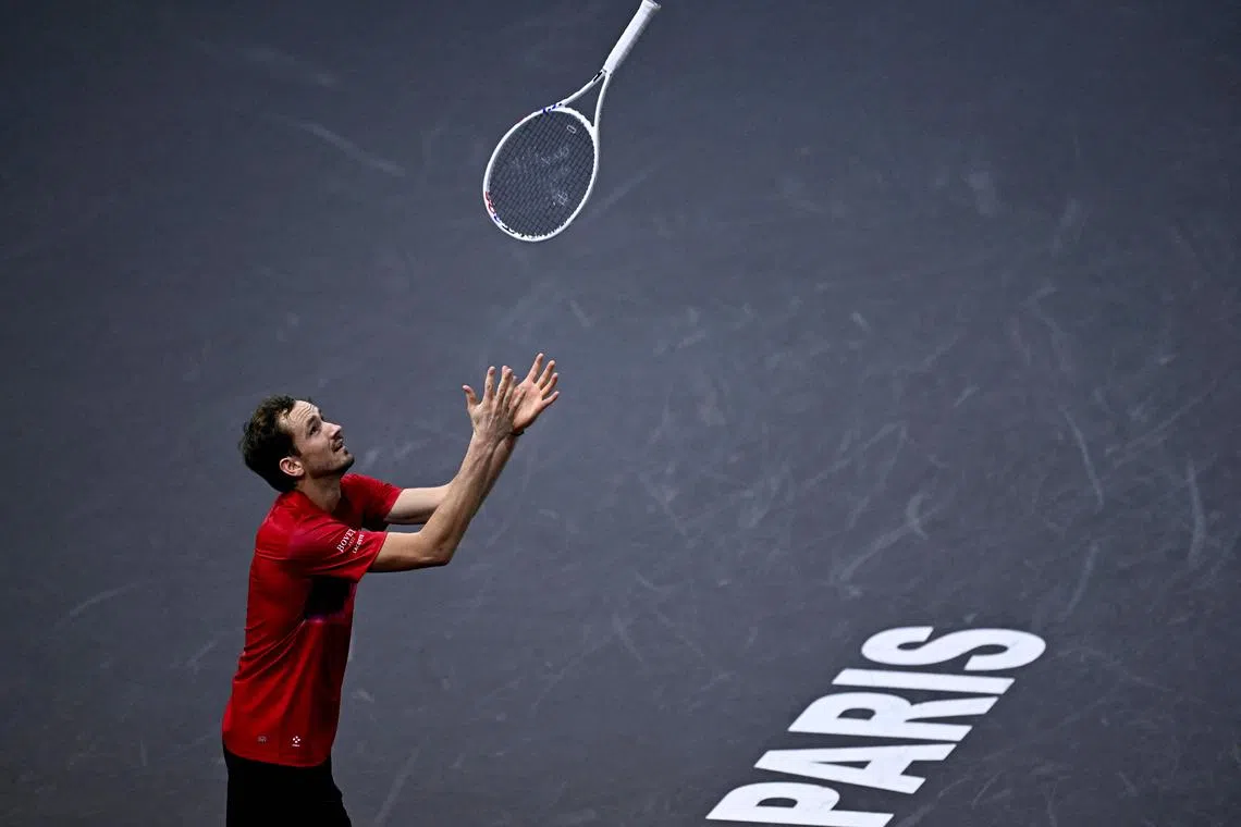 Russia's Daniil Medvedev throws his racket as he plays against Australia's Alexei Popyrin during their men's singles match.