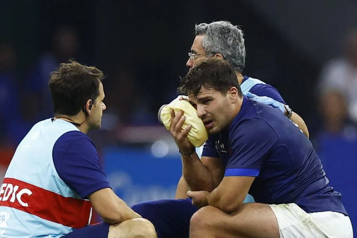 Rugby Union - Rugby World Cup 2023 - Pool A - France v Namibia - Orange Velodrome, Marseille, France - September 21, 2023 France's Antoine Dupont receives medical attention after sustaining an injury REUTERS/Peter Cziborra
