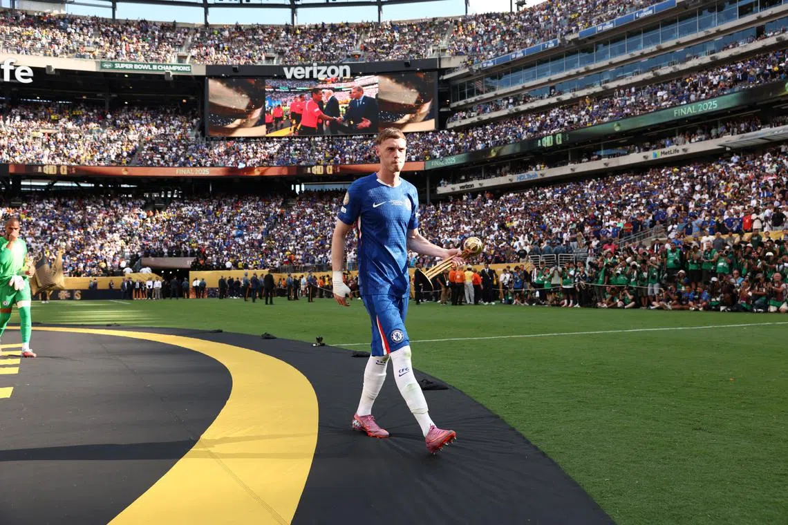 FILE PHOTO: Chelsea's Cole Palmer holds the golden ball trophy after Chelsea won against Paris St Germain in the FIFA Club World Cup final, at the MetLife Stadium in East Rutherford, New Jersey, U.S., July 13, 2025. REUTERS/Kevin Lamarque/Pool/File Photo