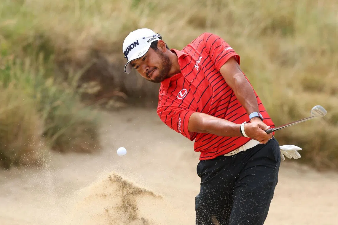 Hideki Matsuyama of Japan playing a shot from a bunker during a practice round prior to the US Open at the Los Angeles Country Club.
