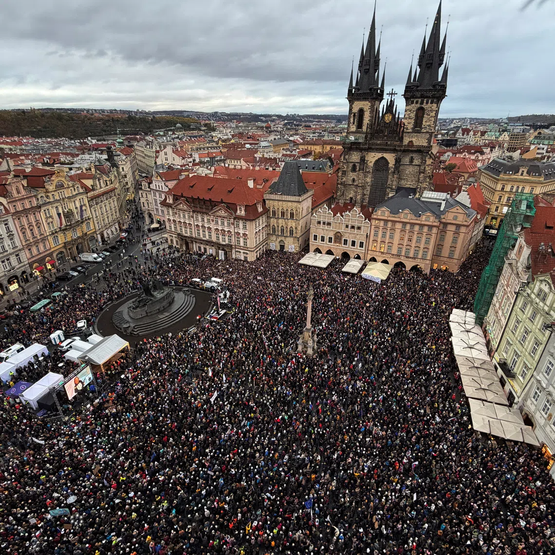 People attend a protest rally in support of public media at the Old Town Square in Prague, Czech Republic, on Oct 25.