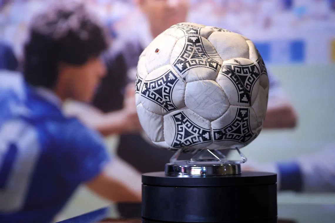 The match ball used in the 1986 World Cup quarter-final between Argentina and England, played at the Estadio Azteca, Mexico City, is pictured during a photo call ahead of its auction on Nov 1. 