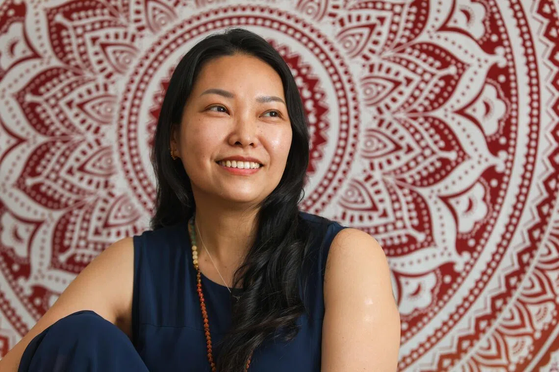 Ms Laurine Lim, 49, set up a yoga and wellness studio, Laya Studio, after yoga helped her heal from perimenopause symptoms. 
