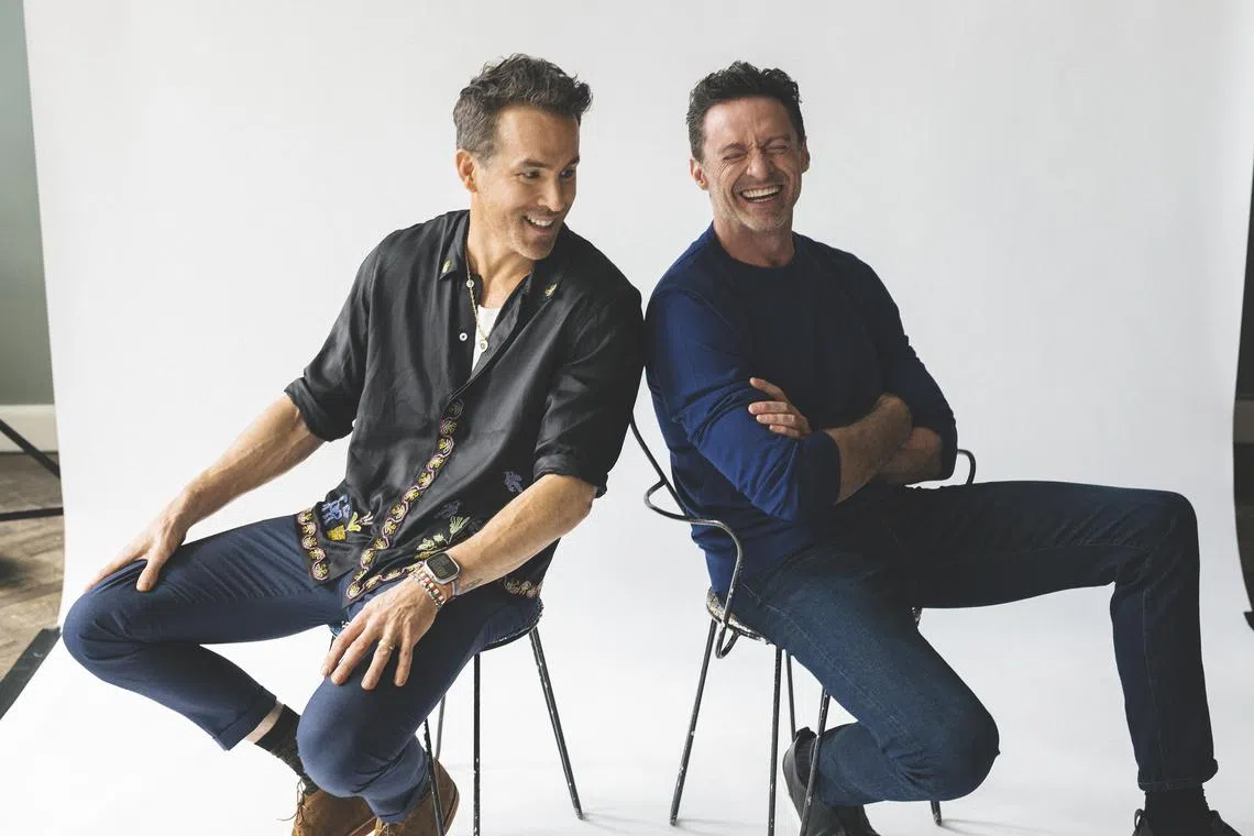 Ryan Reynolds, left, and Hugh Jackman, close friends, in Berlin on July 6, 2024. The two friends have learned a lot about being the stewards of major pop-culture characters, an education that led them to “Deadpool & Wolverine.” (Mustafah Abdulaziz/The New York Times)