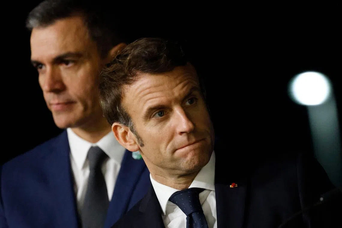 Spanish Prime Minister Pedro Sanchez (left) and French President Emmanuel Macron hold a joint press conference with other leaders at the Euro-Mediterranean Group Summit, on Dec 9, 2022, in Spain's Alicante..