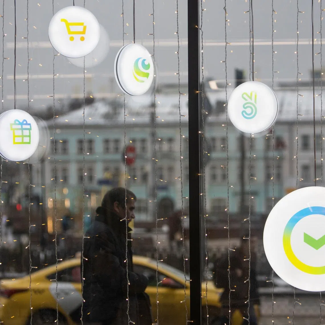 A man walks past an office of the Russian largest lender Sberbank in Moscow, Russia December 24, 2020. REUTERS/Maxim Shemetov