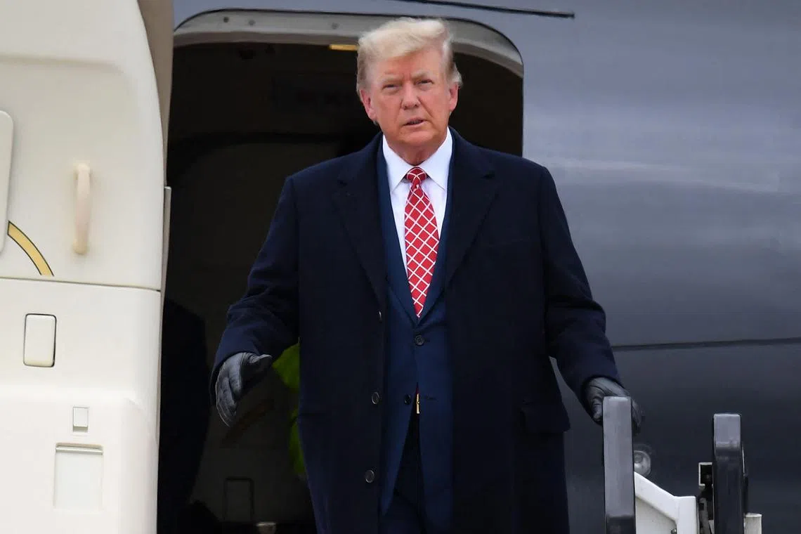 Former US president Donald Trump disembarks "Trump Force One" at Aberdeen airport in Scotland on May 1, 2023.