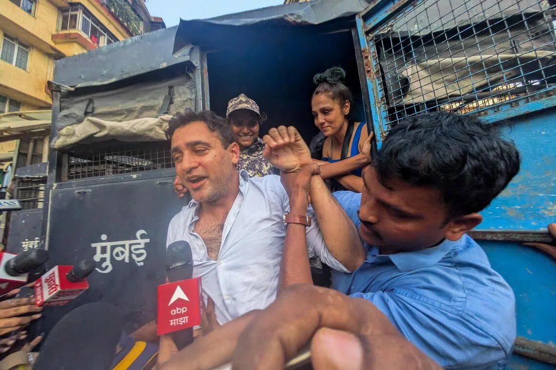 Bollywood actor Imran Khan is detained by security personnel during a protest by the Cockroach Janta Party (CJP) seeking the resignation of India's Chief Election Commissioner Gyanesh Kumar, in Mumbai, India, October 10, 2026. REUTERS/Stringer