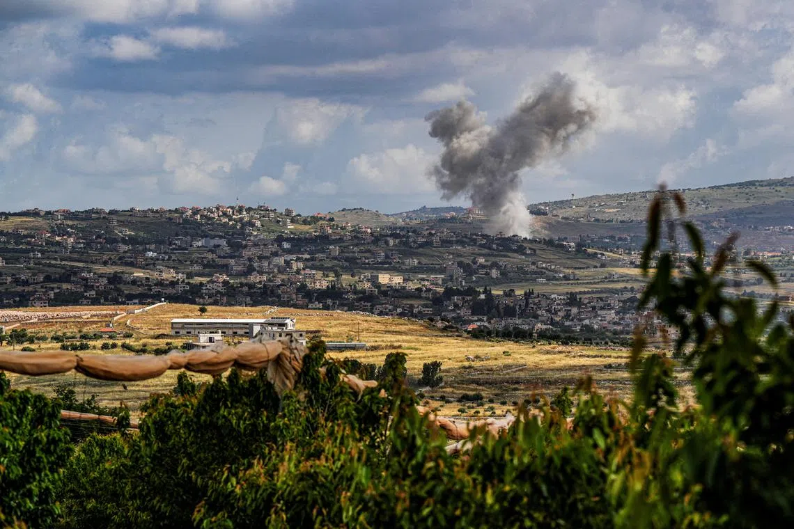 FILE PHOTO: Smoke rises above south Lebanon following an Israeli strike amid ongoing cross-border hostilities between Hezbollah and Israeli forces, as seen from Israel's border with Lebanon in northern Israel, May 5, 2024. REUTERS/Ayal Margolin/File Photo
