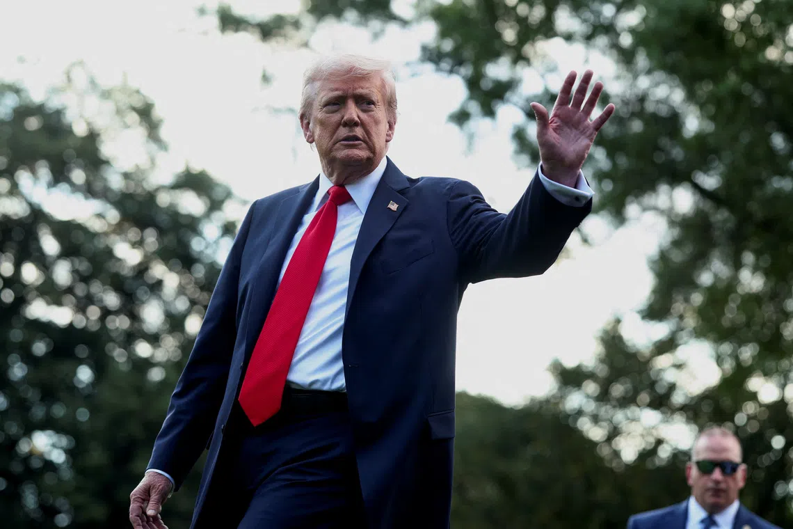 U.S. President Donald Trump waves to the media before boarding Marine One upon departure for New York, in Washington, D.C., U.S., September 11, 2025. REUTERS/Evelyn Hockstein/File Photo
