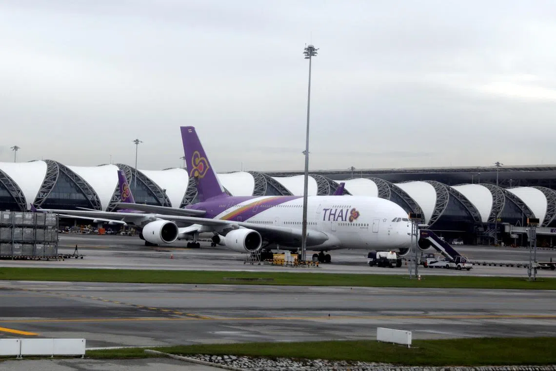FILE PHOTO: Workers service a Thai Airways Airbus A380-800 aircraft at Bangkok International Suvarnabhumi Airport, Thailand September 3, 2019. Picture taken September 3, 2019. REUTERS/Amr Abdallah Dalsh/File Photo