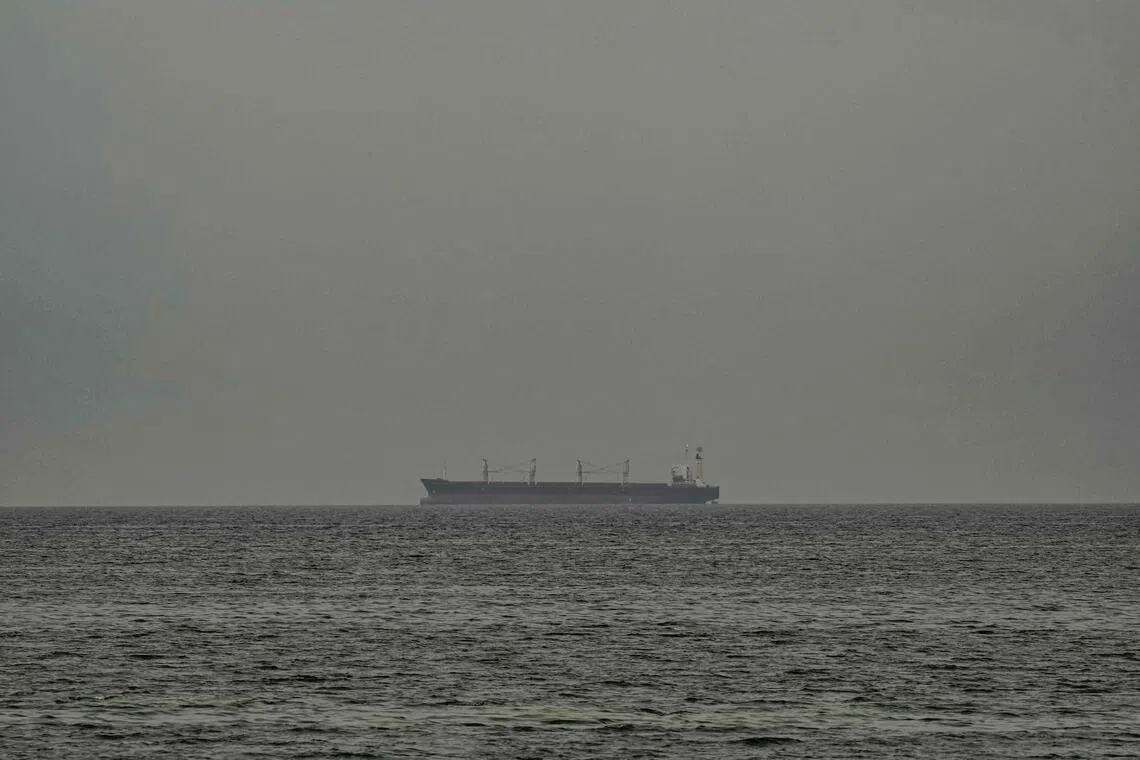 A ship is seen in the Persian Gulf off the coast of Sharjah the day after the failure of US-Iran peace talks on April 13, 2026.