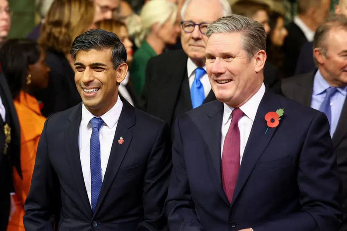 British Prime Minister Rishi Sunak and Labour Party leader Keir Starmer react on the day of the State Opening of Parliament, at the Houses of Parliament, in London, Britain November 7, 2023. REUTERS/Hannah McKay/Pool