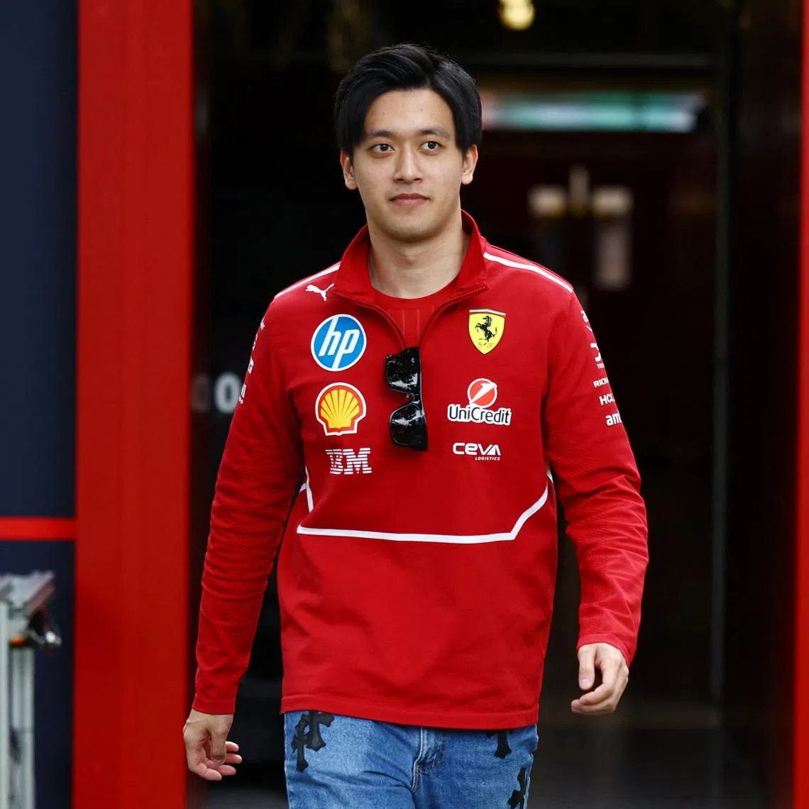 FILE PHOTO: Formula One F1 - Australian Grand Prix - Albert Park Grand Prix Circuit, Melbourne, Australia - March 13, 2025 Ferrari's reserve driver Zhou Guanyu at the Albert Park Grand Prix Circuit ahead of the Australian Grand Prix REUTERS/Edgar Su/File Photo