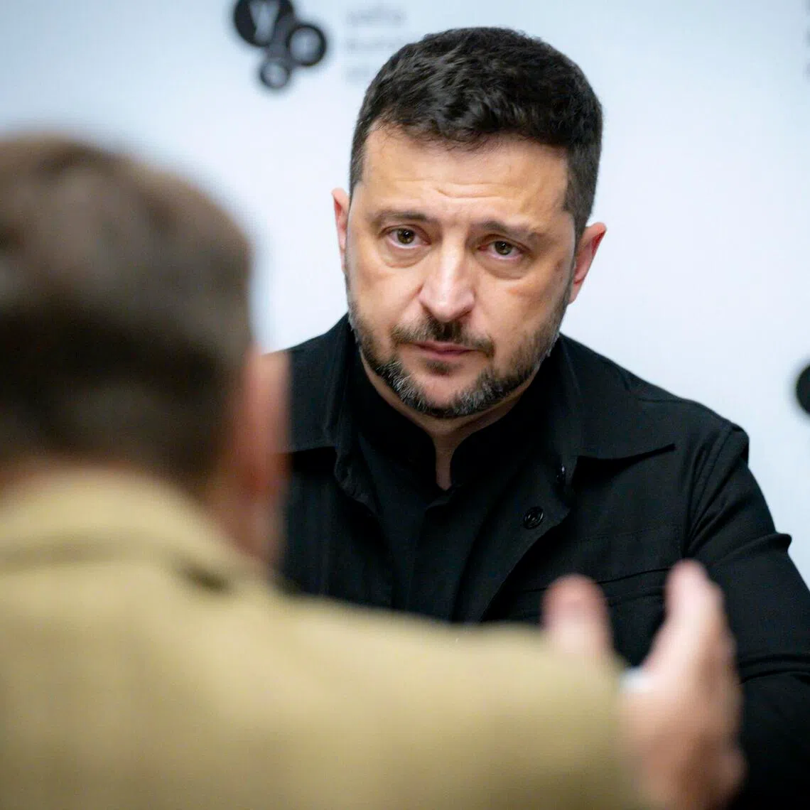 A Russia-backed website mimicking Britain's Daily Telegraph newspaper claimed Ukrainian President Volodymyr Zelensky (right) had embezzled money for an offshore property empire.