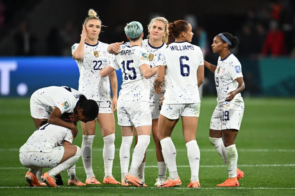 US players comforting each other after they were eliminated from the Women's World Cup by Sweden on Aug 6.